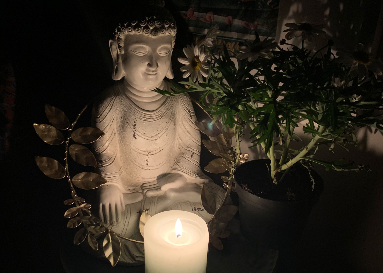 buddha with candle